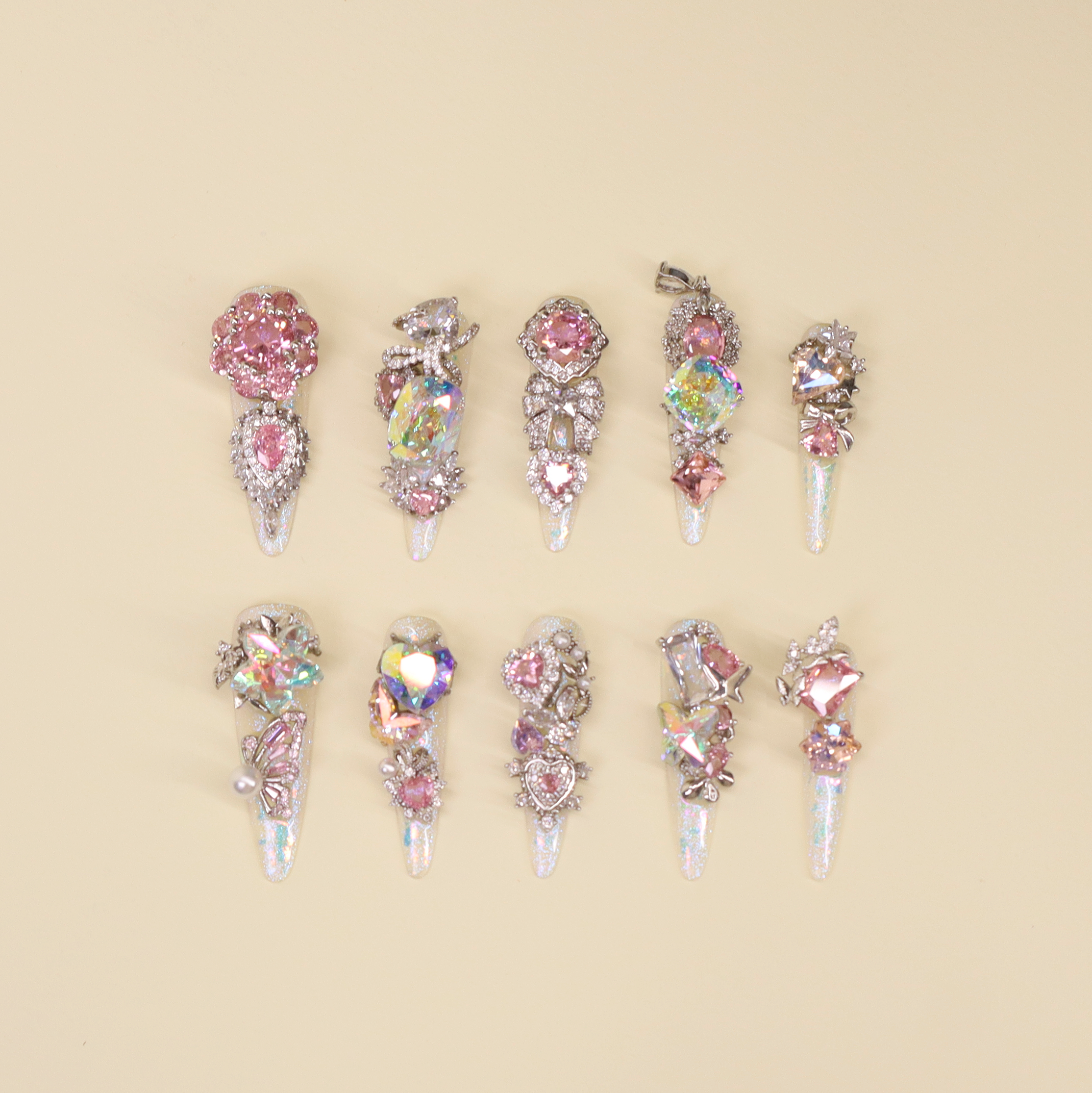 Luxury press on nails La Trace featuring icy translucent base with soft pink shimmer and crystal accents, elegant signature nail design