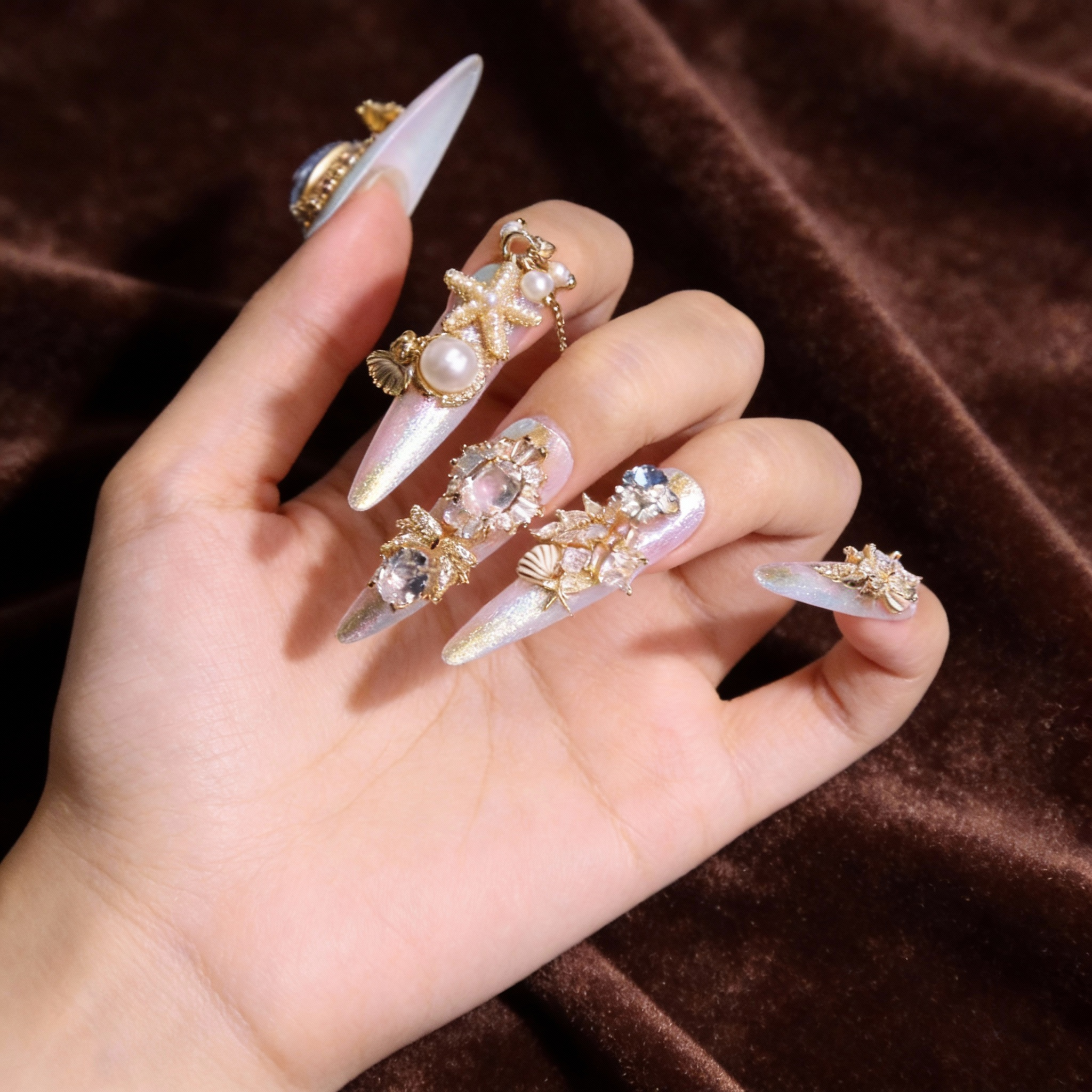 Dreamy mermaid nails with blended shimmer base and luxury 3D details