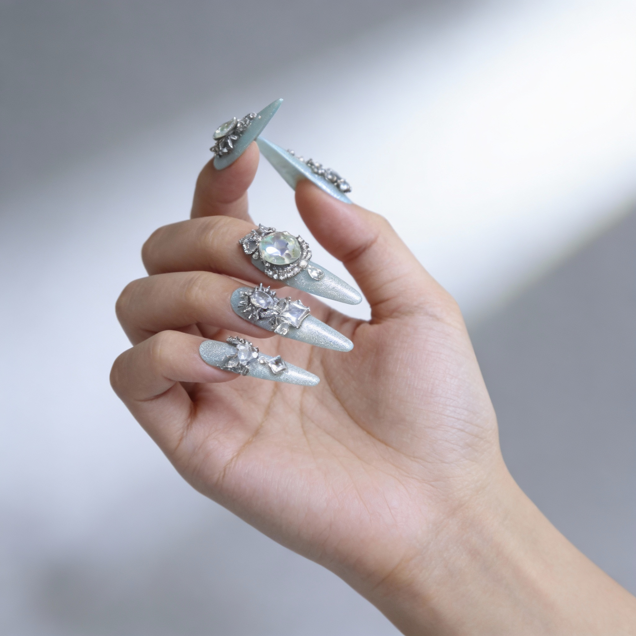 Icy mint green sparkly nails with fine shimmer, elegant press on nails style