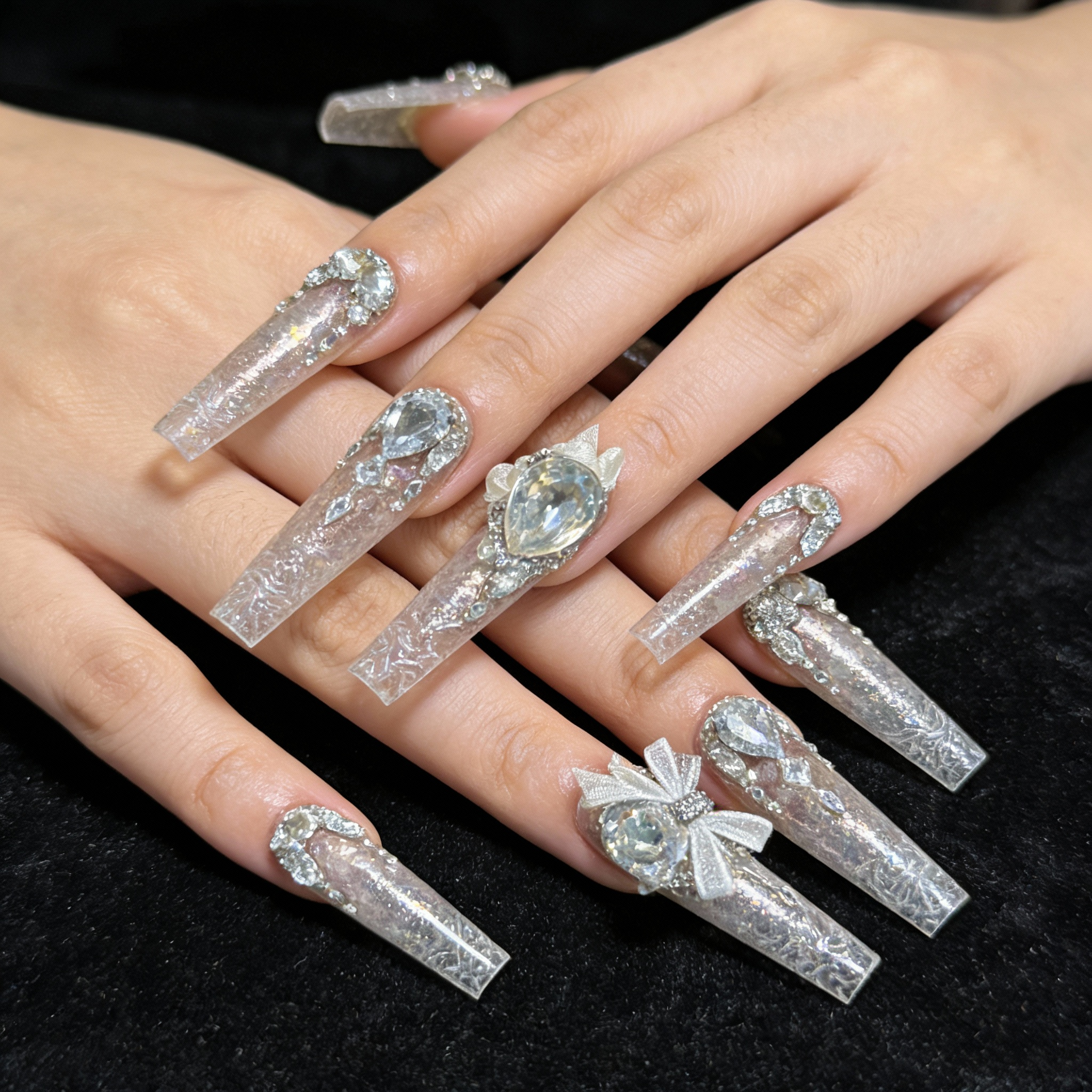 Hand wearing Glacier Sparkle winter sparkly nails featuring translucent ice-like layers and high-shine crystal sparkle.