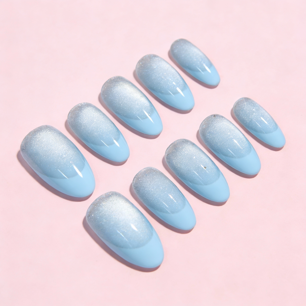 Icy blue sparkly French tip press-on nails with frosted winter shimmer