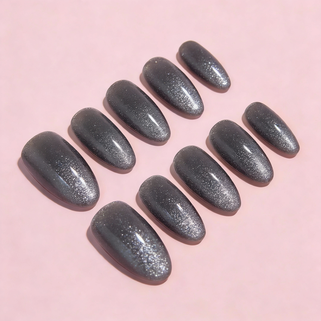 Smoke Ash Sparkle press-on nails with a deep ash grey base and fine silver shimmer, a modern winter sparkly nails design.