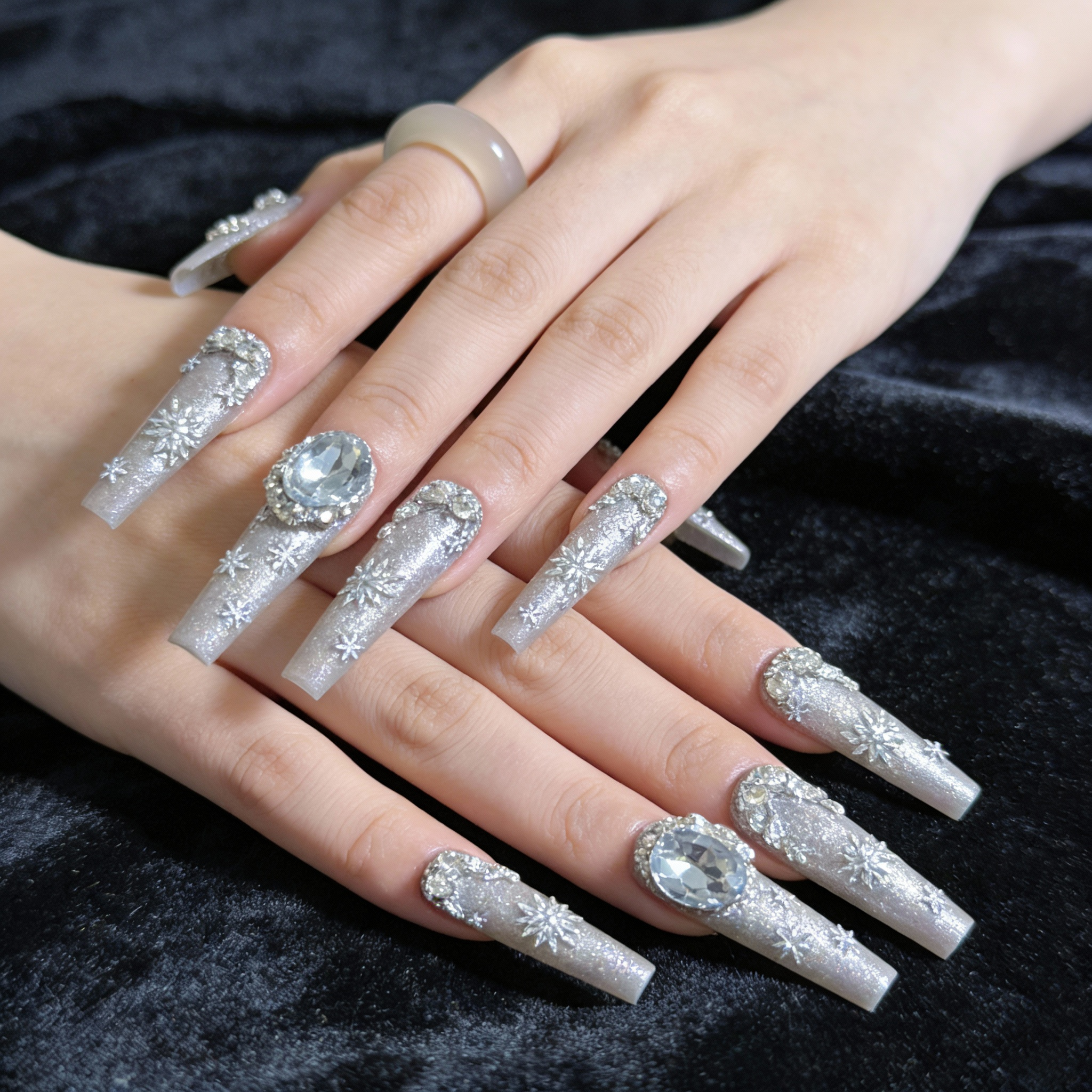 Close-up of Snowfall Day winter sparkly nails showing fine shimmer and snowflake accents